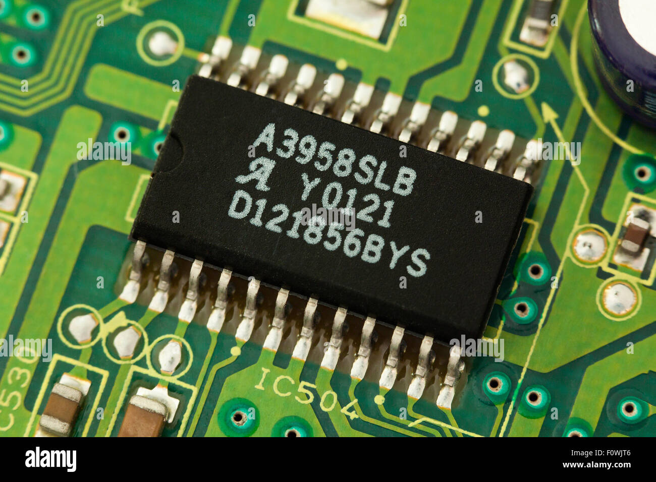 Circuit board showing closeup of surface mounted IC chip Stock Photo