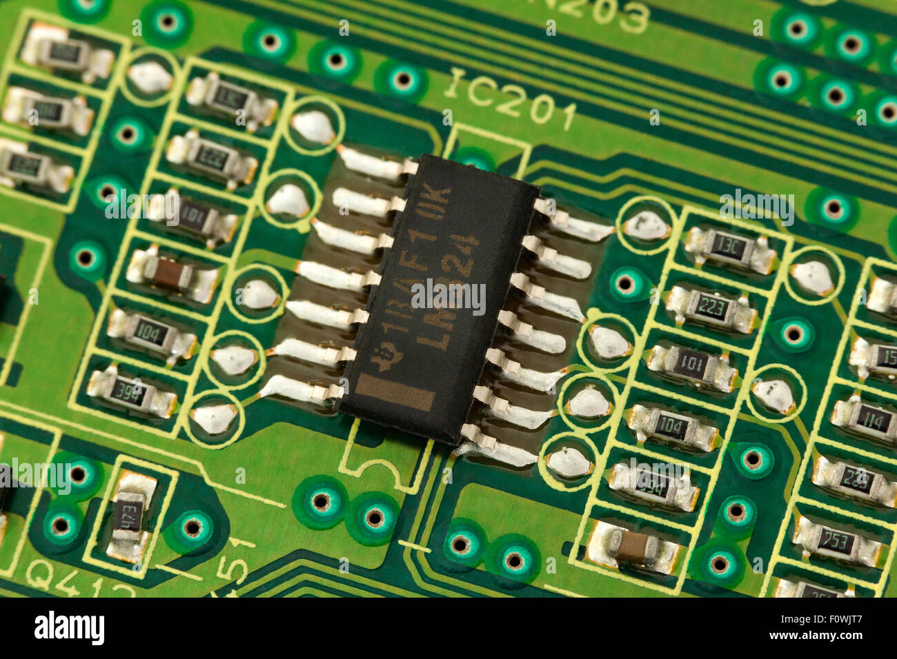 Circuit board showing closeup of surface mounted IC chip Stock Photo
