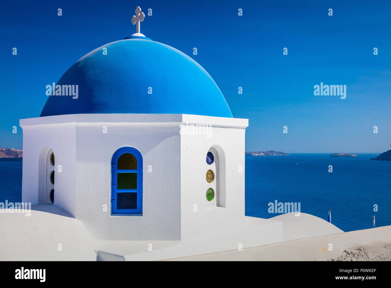 Iconic blue domed chapel in the town of Oia on the greek island Santorini (Thera) Stock Photo