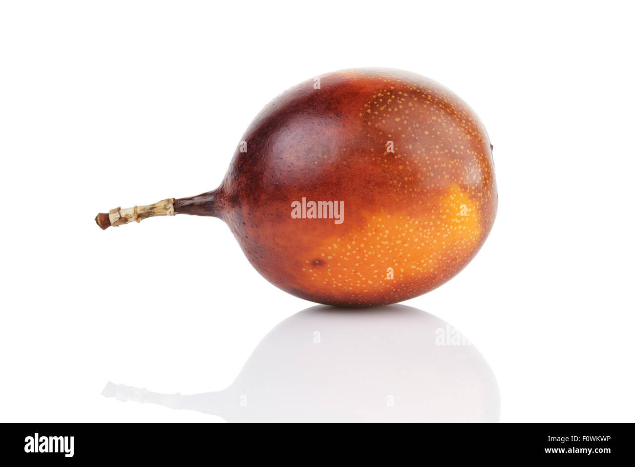 One Ripe Fruit one ripe whole passionfruit Stock Photo - Alamy