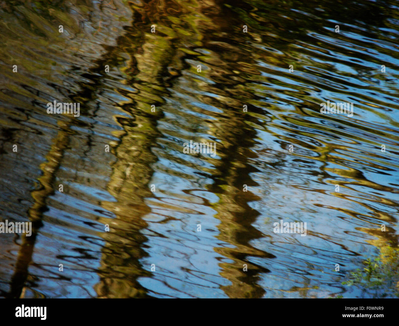 Rippling water reflects clear blue skies Stock Photo