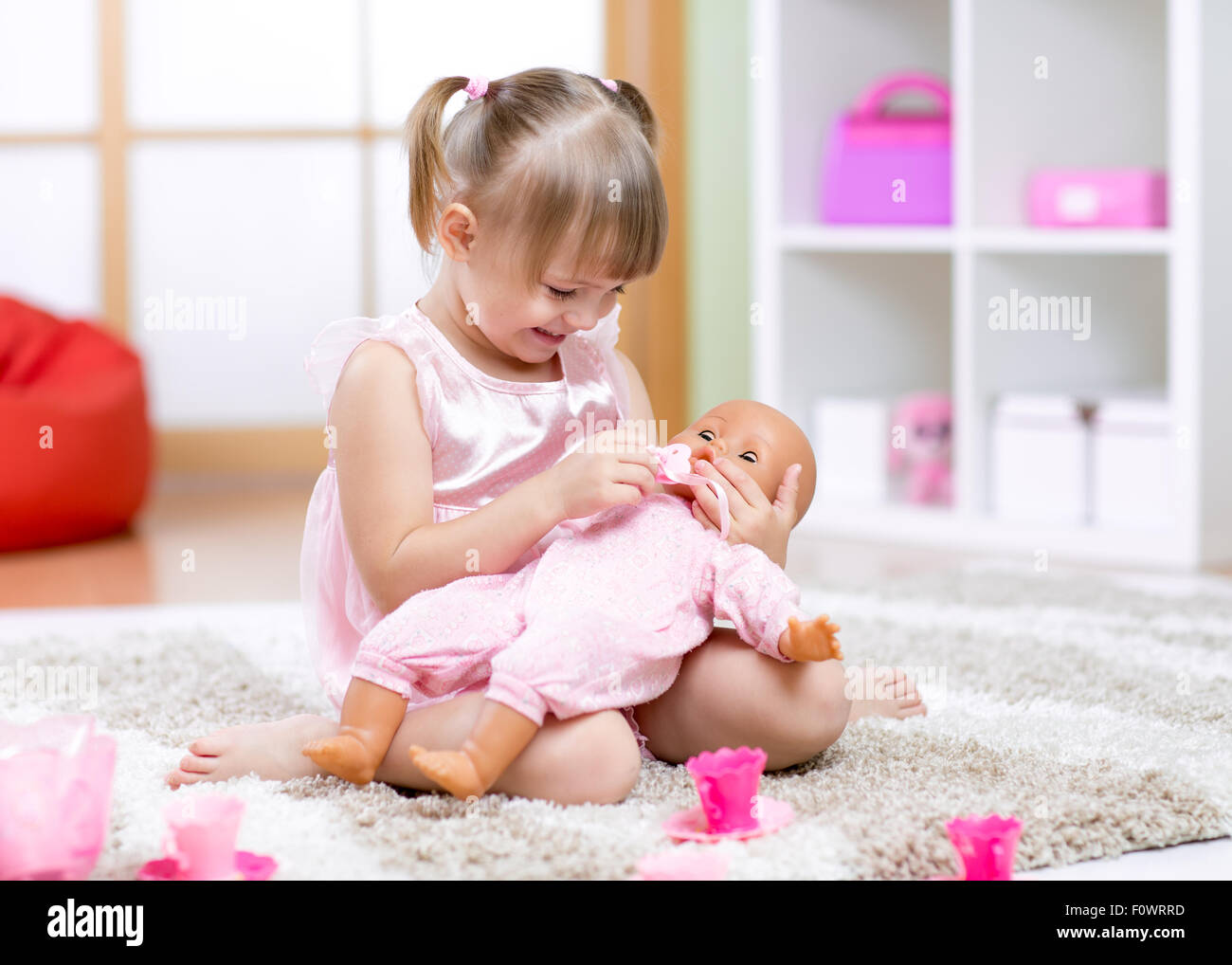 Cheerful little girl play in preschool Stock Photo