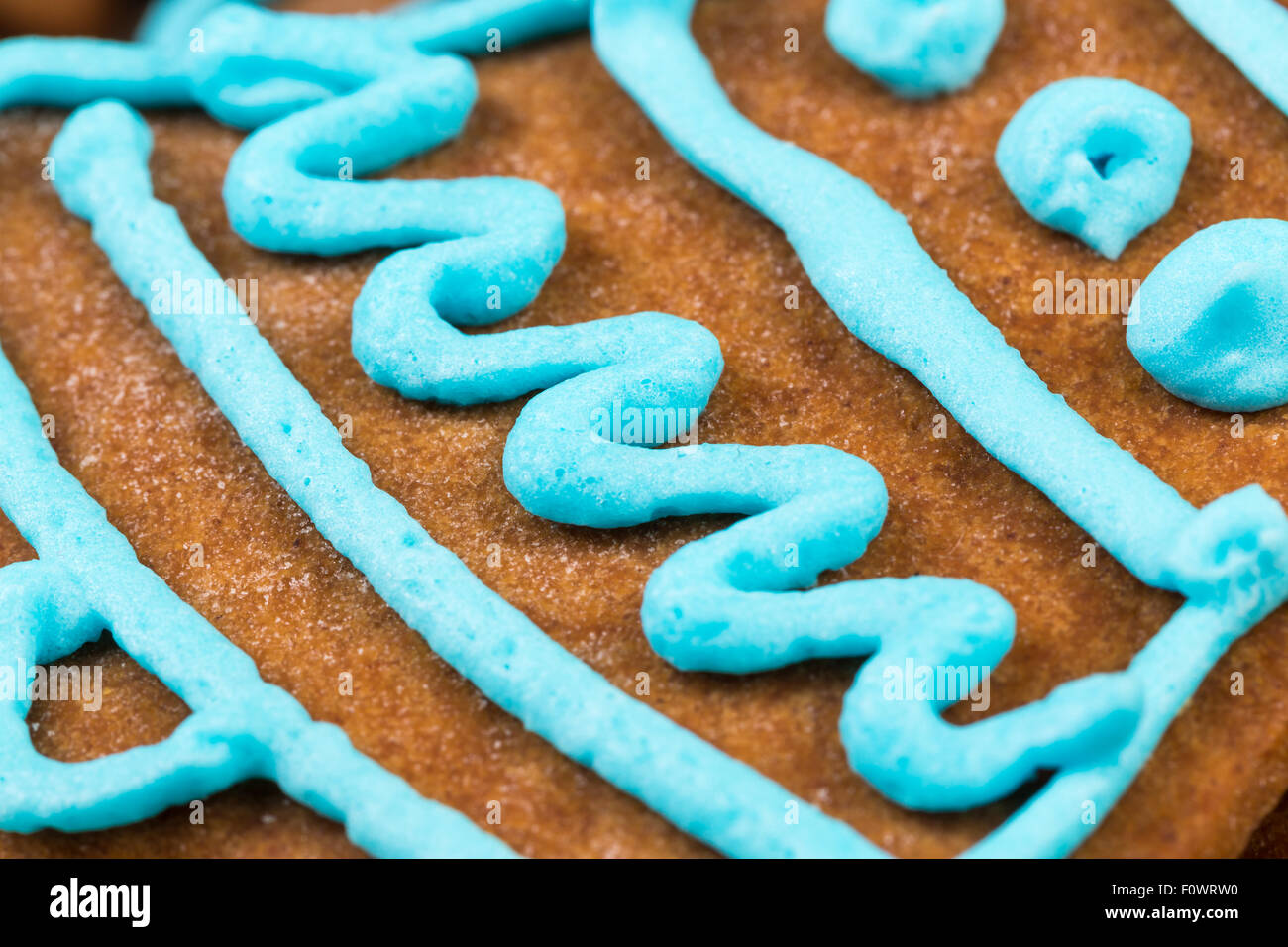 Blue glaze gingerbread cookie close up shot Stock Photo