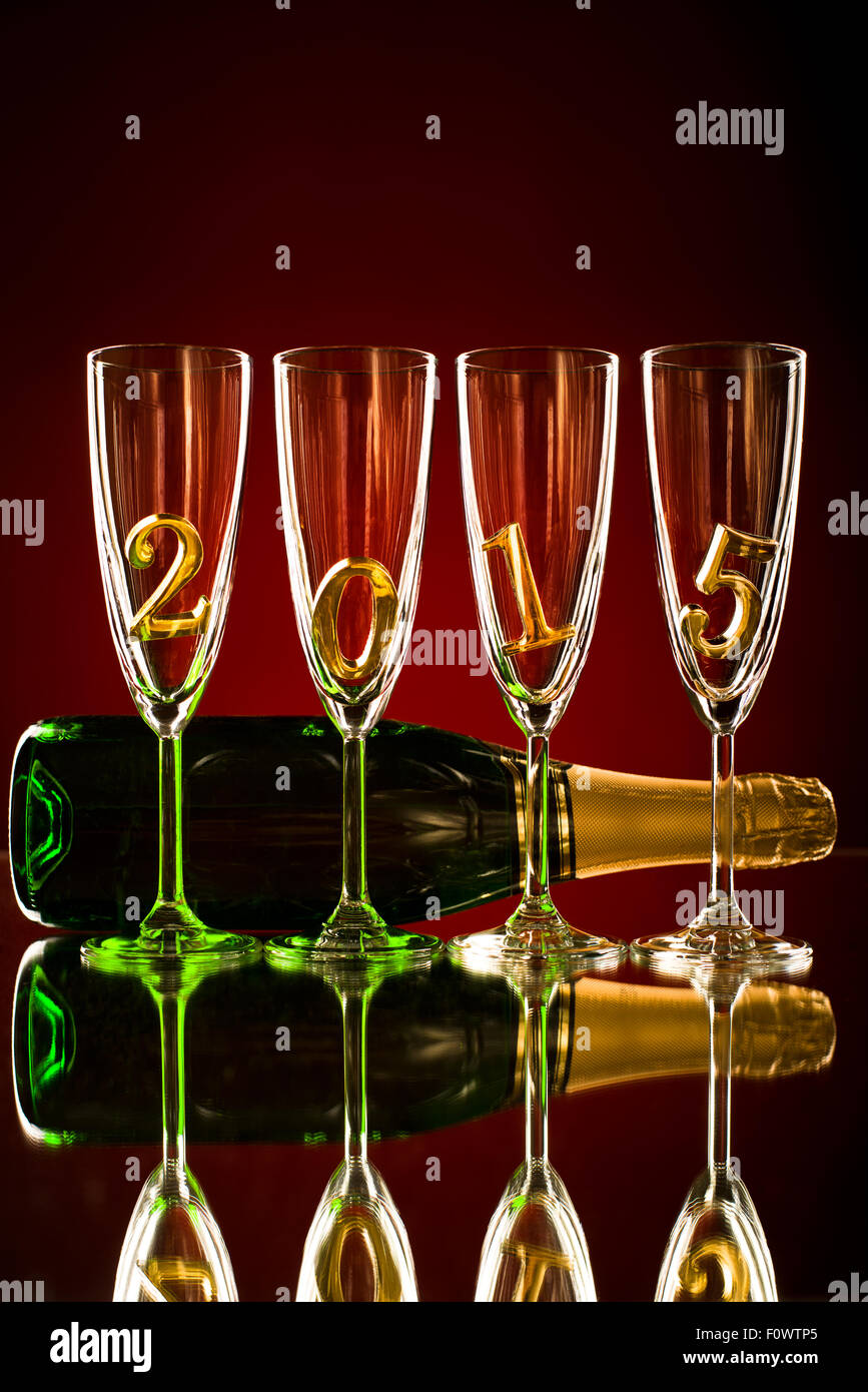 bottle  champagne with four glass goblet and  numeral 2015,  beautiful celebrations  New Year concept photo Stock Photo