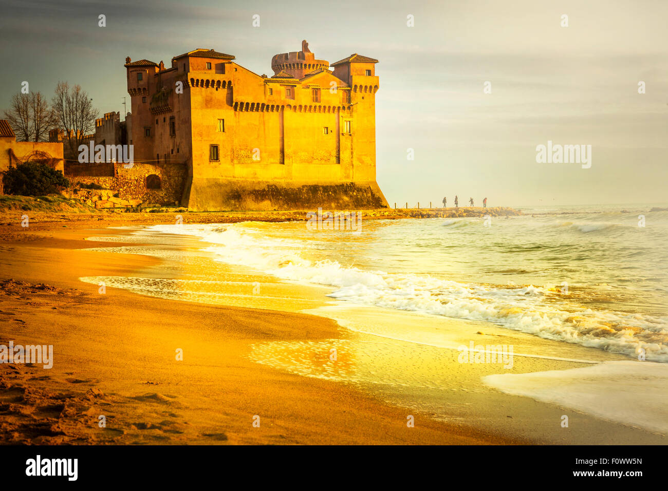 Golden sunset and medeival castle in Santa Severa, Italy Stock Photo