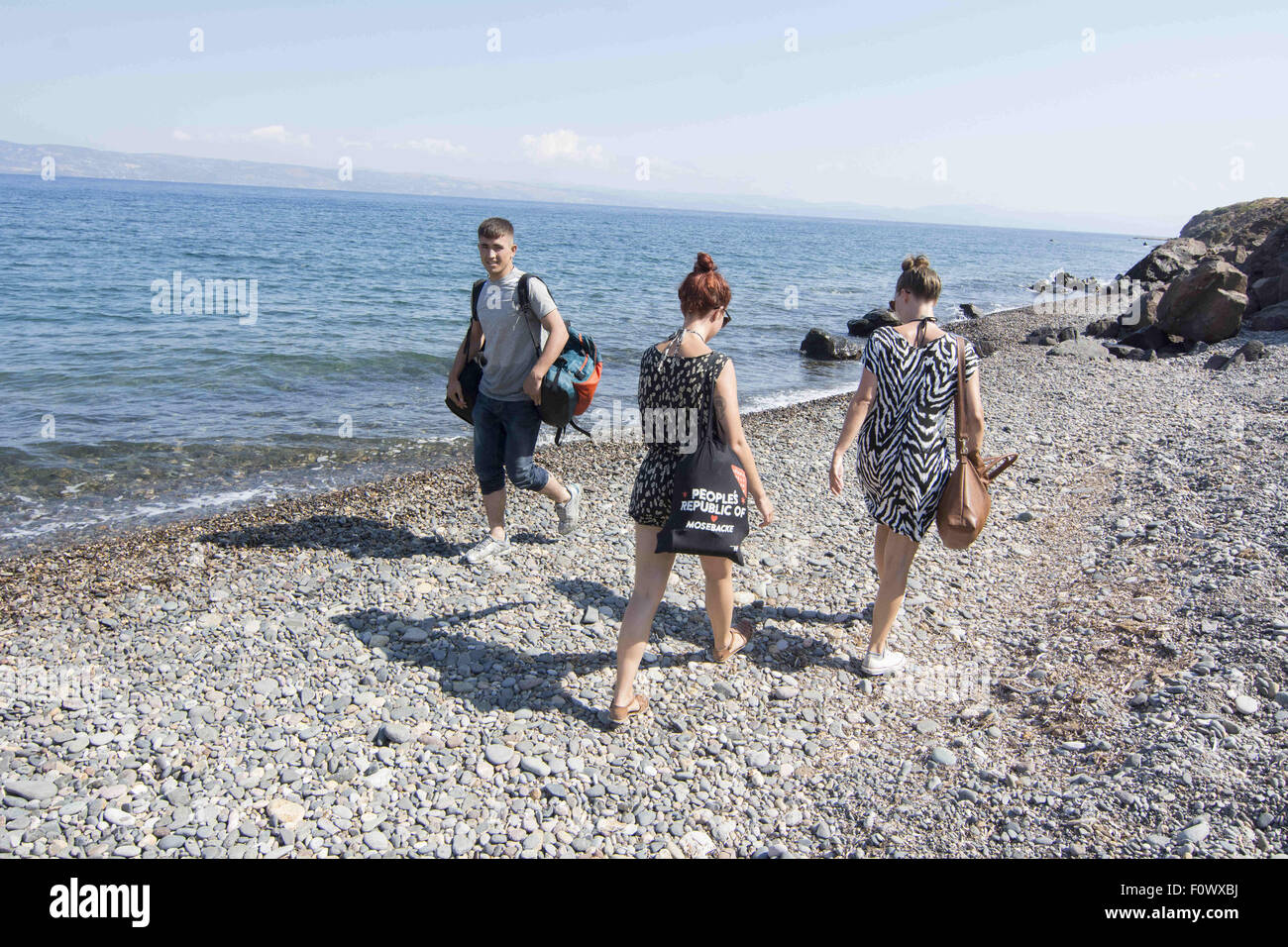 Lesbos, Greece. 22nd Aug, 2015. Migrants from Afghanistan pass by ...