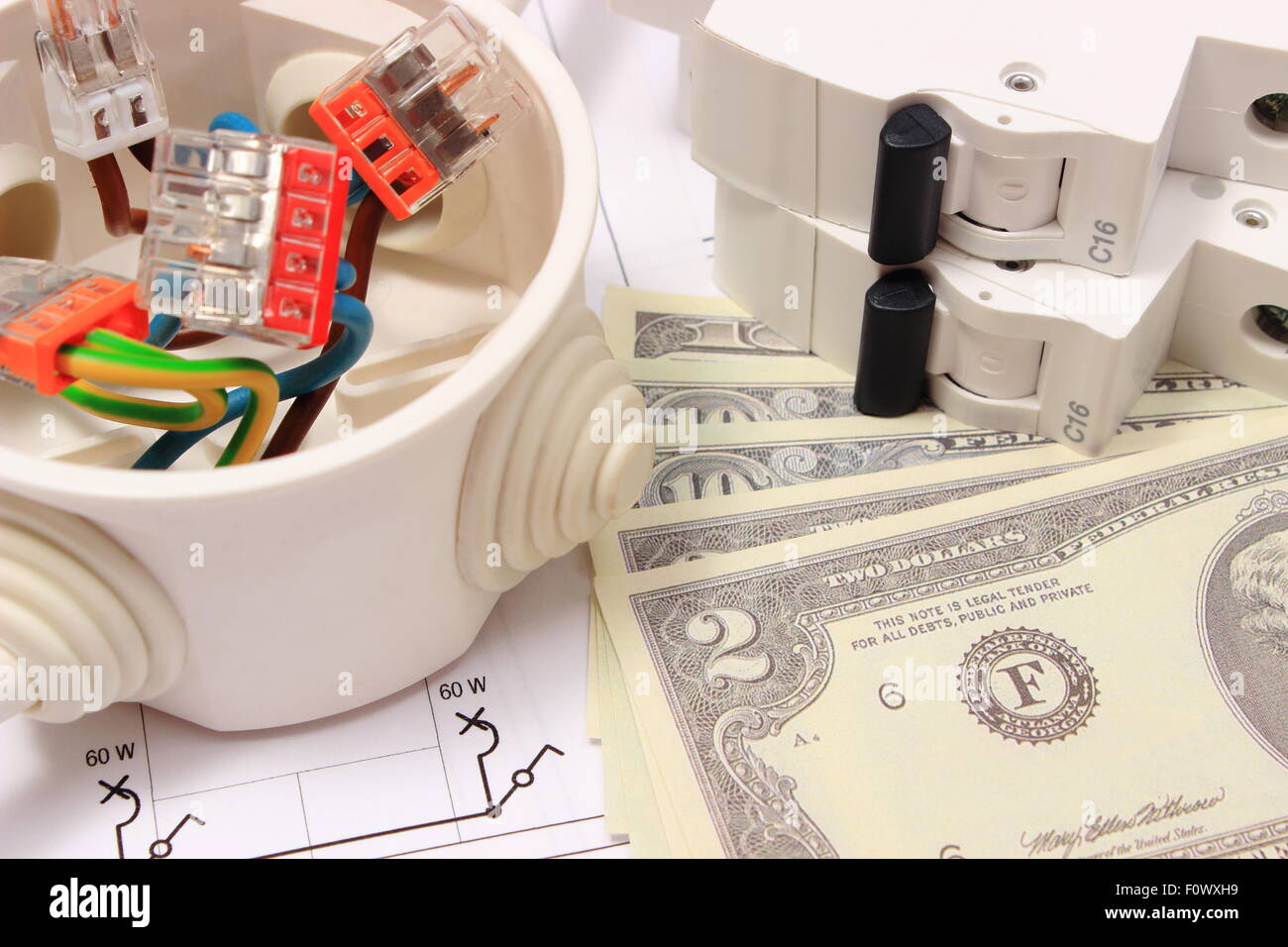 Copper wire connections in electrical box, electric fuse and money on