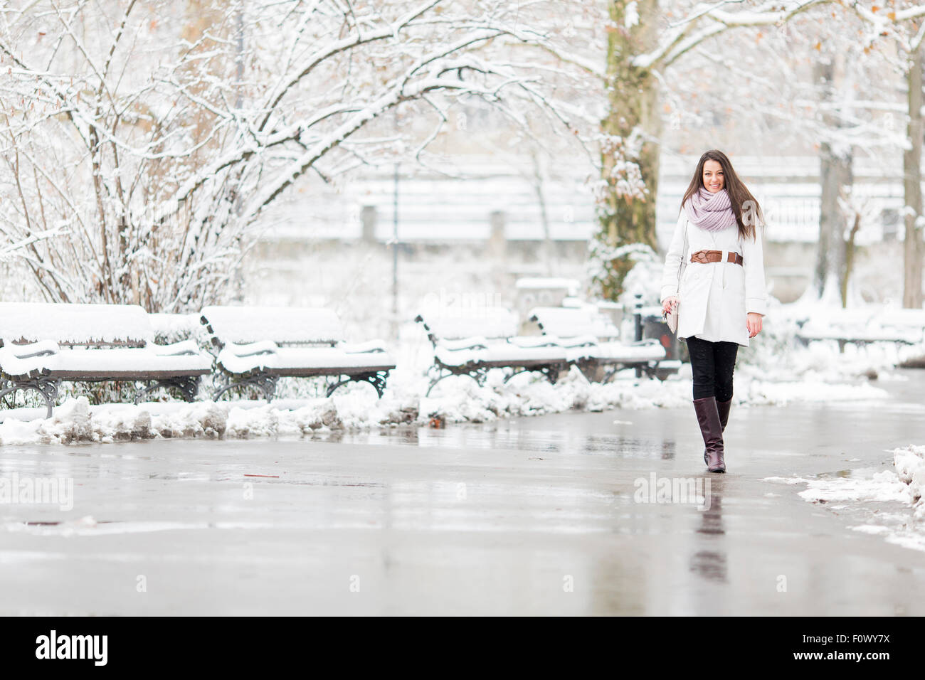 Young woman in park at winter Stock Photo - Alamy