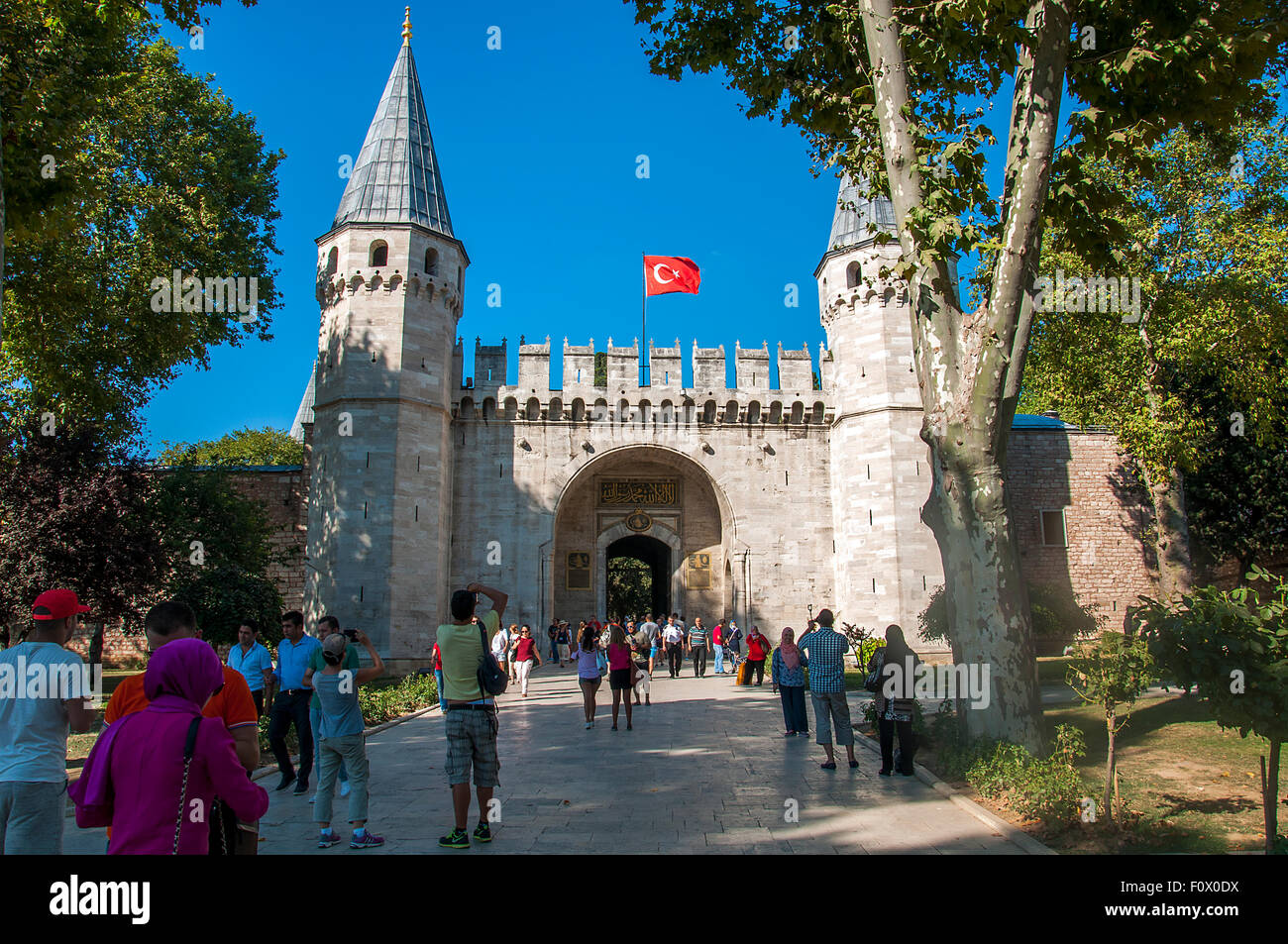 Istanbul, Turkey - August 19, 2015: Tourists entering the Gate of Salutation of Topkapi Palace Stock Photo