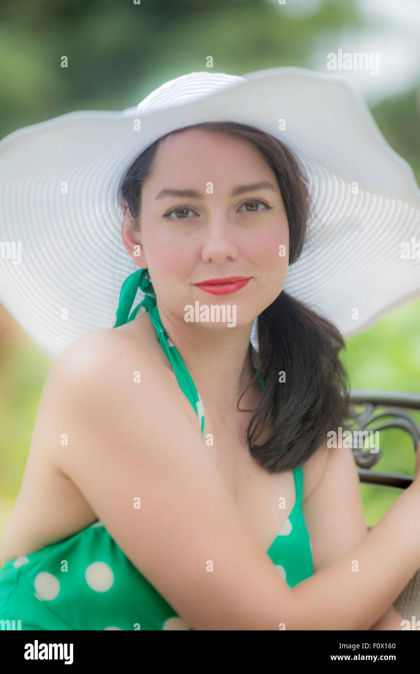 Pretty young woman wearing a white hat Stock Photo