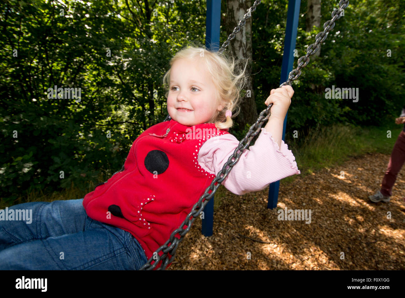 Little girl on swing. Stock Photo