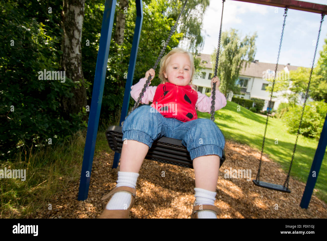 Little girl on swing. Stock Photo