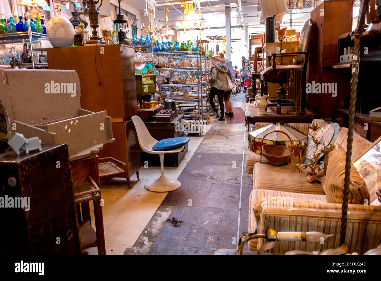 New York City, USA, Couple Shopping, Inside, browsing vintage shop, Brooklyn District, DUMBO Area, antique furniture shop interior, shop interior 1960s Stock Photo