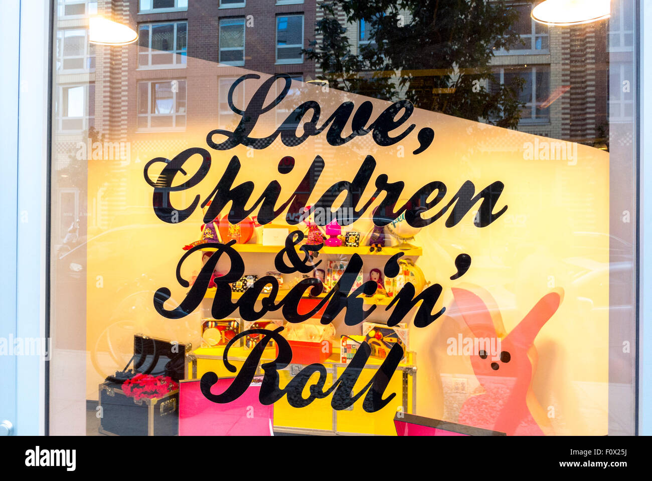 New York City, USA, Slogan in Local Children's Clothing Shop Front Window, Brooklyn District, DUMBO Area, 'Love Children & Rock'n'Roll' Stock Photo