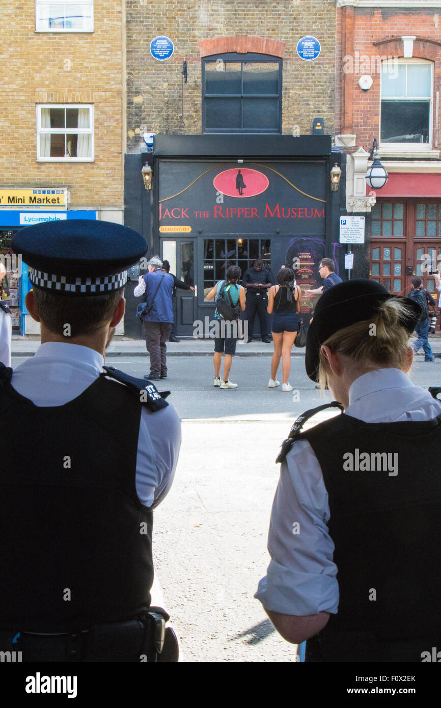 Cable Street, London, August 22nd 2015. Activists from Class War demonstrate against the newly established Jack The Ripper Museum on Cable Street, claiming that it demeans women by profiting off the death of prostitutes killed by the Ripper. The Museum, during its planning stage, claimed that it would be dedicated to the Suffragettes movement. Credit:  Paul Davey/Alamy Live News Stock Photo