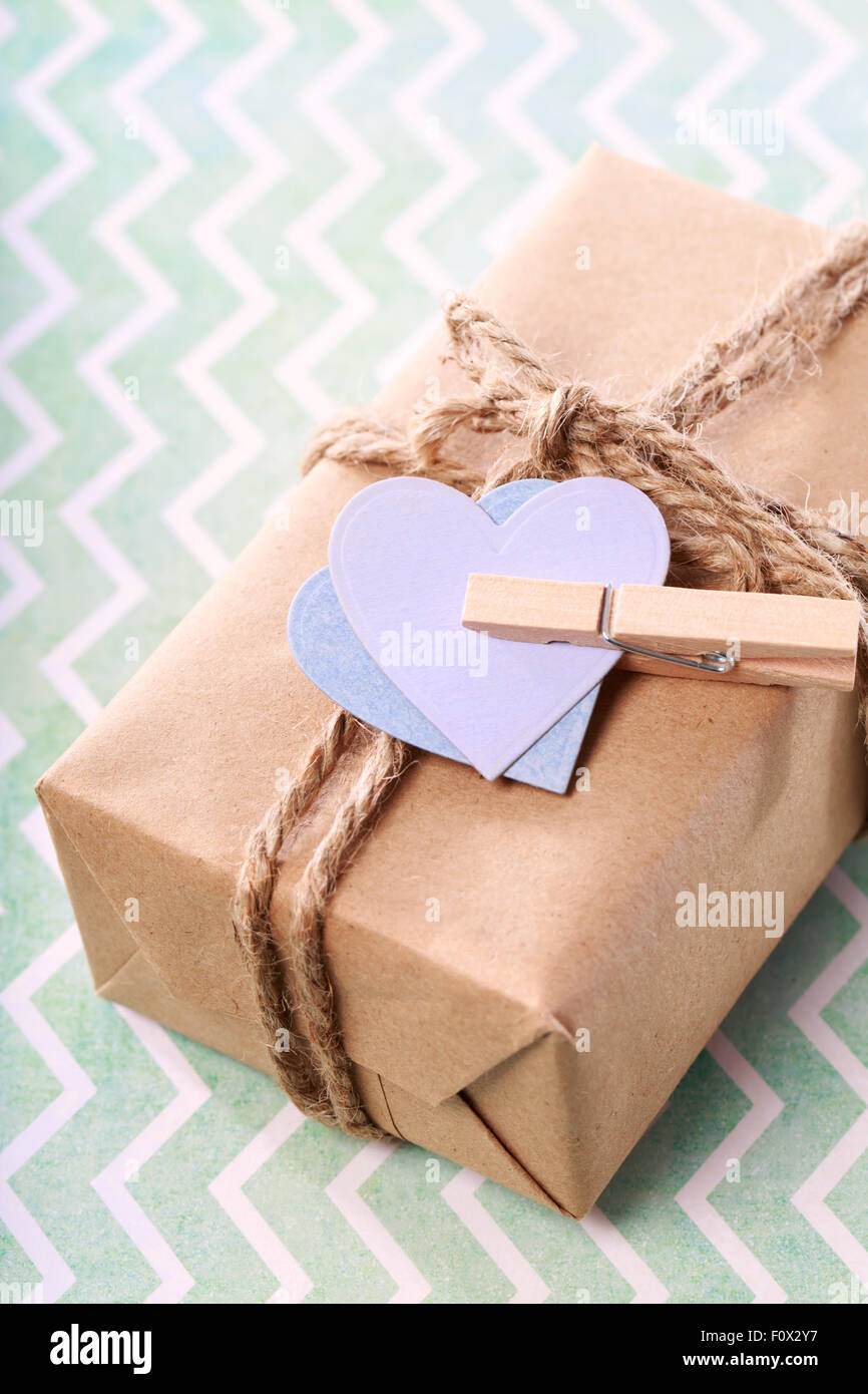 Handmade gift box with purple and blue hearts in rustic style Stock Photo