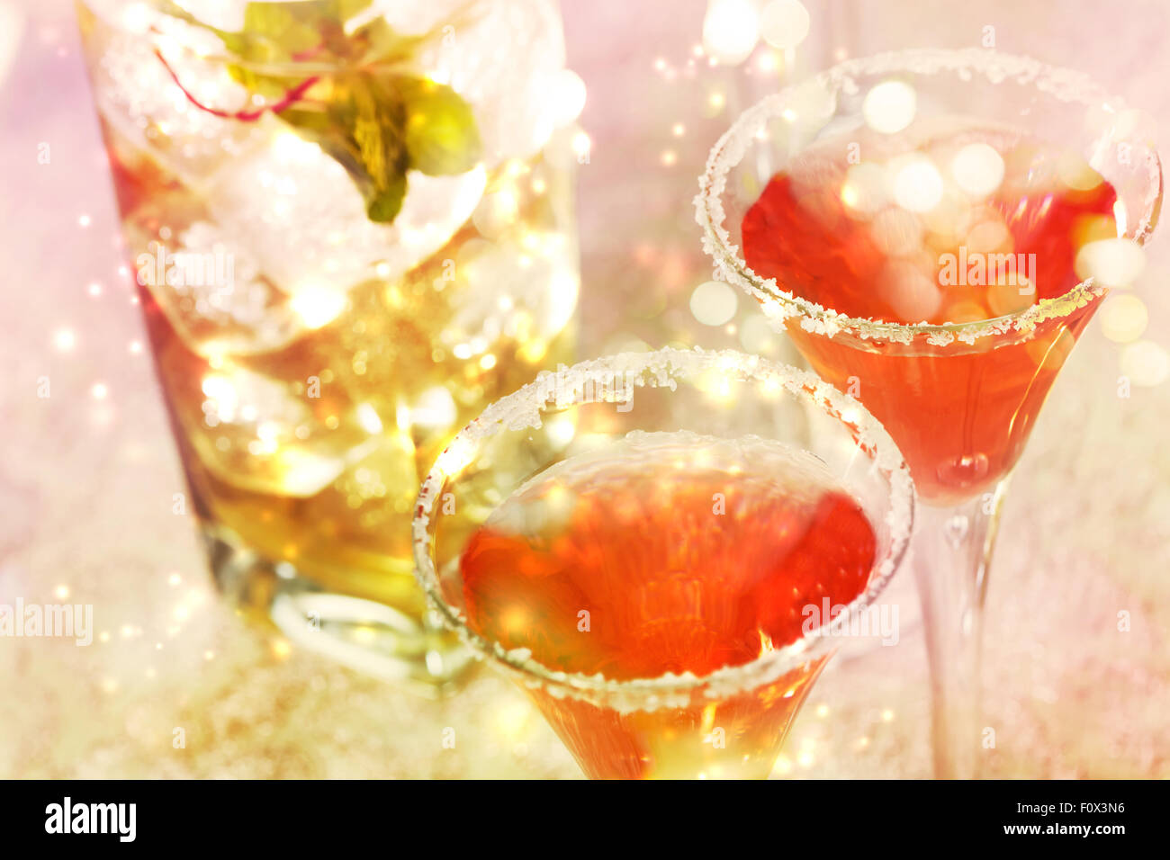 Red cocktail with salt over shiny lights Stock Photo