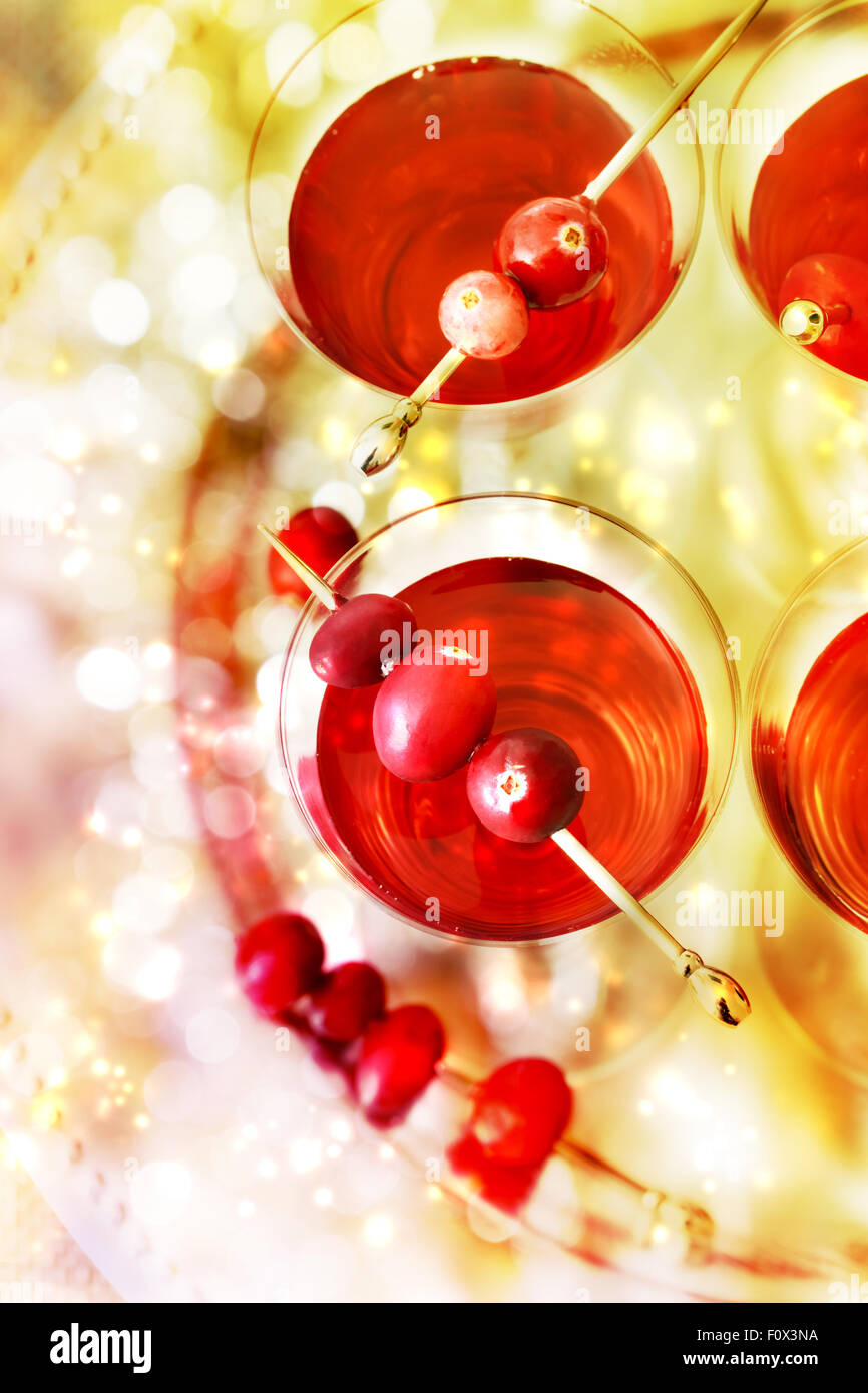 Red and gold themed holiday cocktails with cranberry Stock Photo