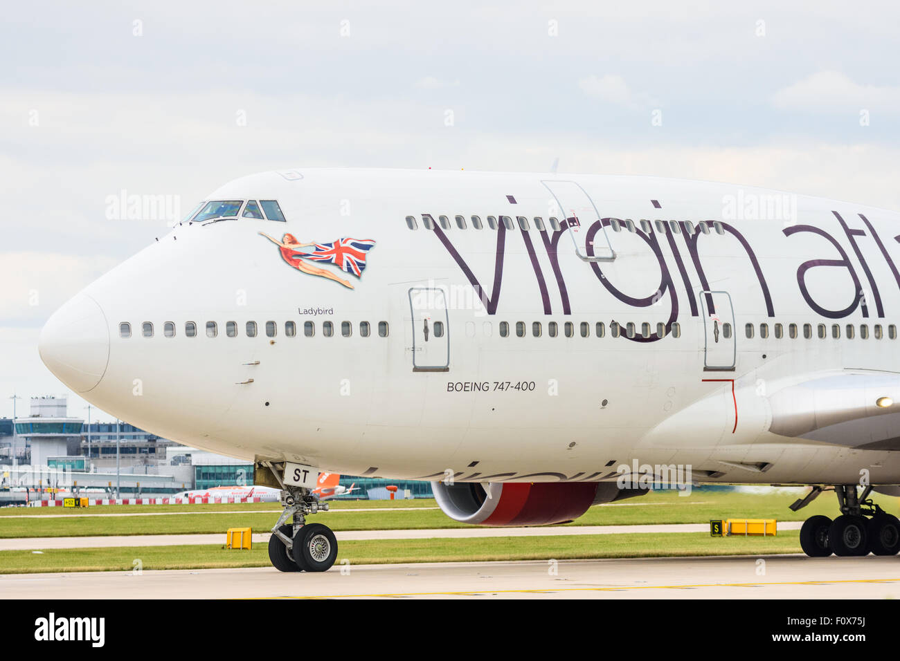 Side view of the front of a Virgin Atlantic Boeing 747-400 aeroplane on the runway at Manchester Airport Stock Photo