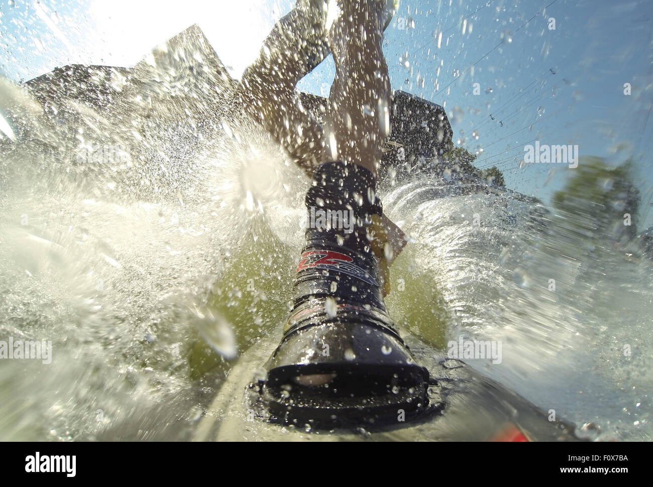 Water Ski Ride Suesel, Germany. 22nd Aug, 2015. A water skier rides along a water ski ...