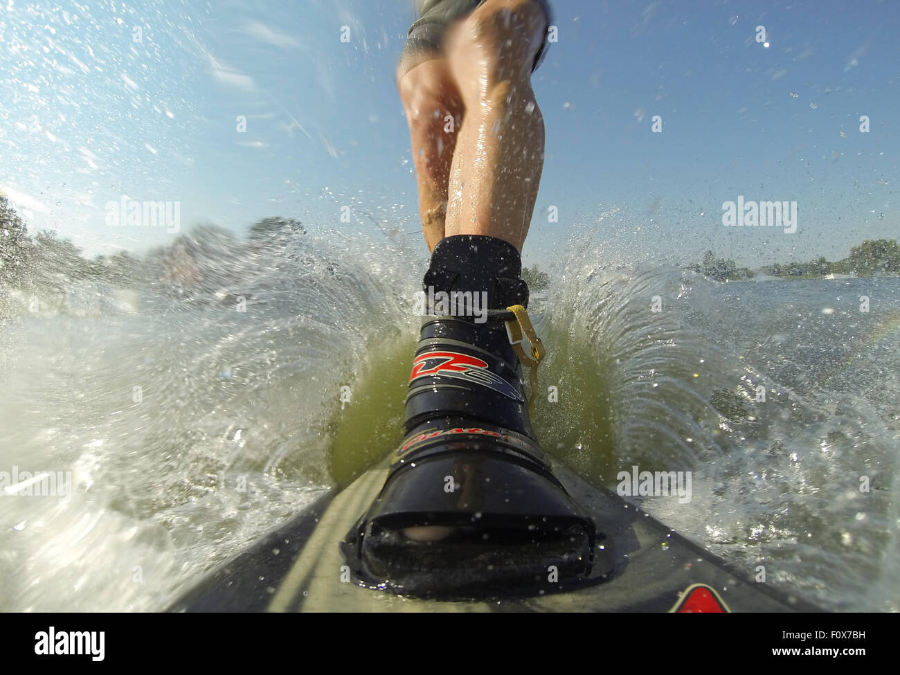 Water Ski Ride Suesel, Germany. 22nd Aug, 2015. A water skier rides along a water ski ...