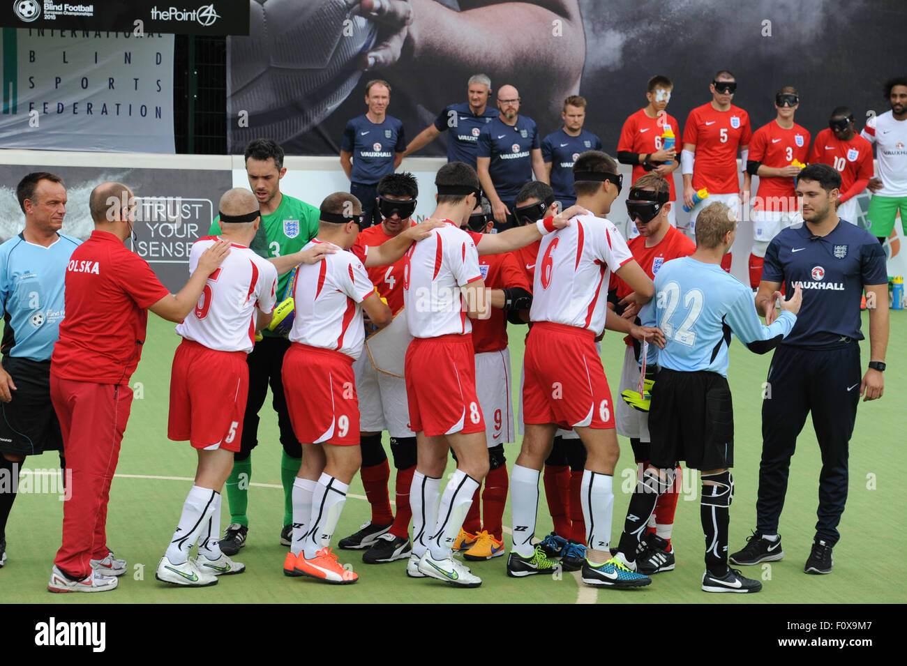 Hereford, UK. 22nd August, 2015. The IBSA Blind Football European Championships 2015 at Point 4, Hereford. England v Poland - The teams shake hands before the opening match. Credit:  James Maggs/Alamy Live News Stock Photo