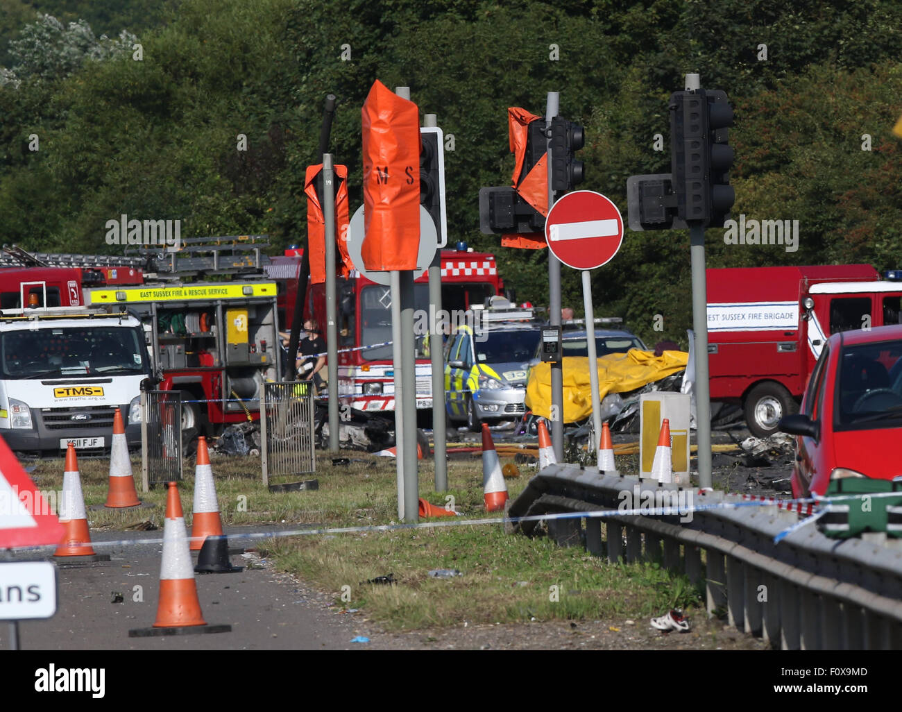 Shoreham, UK. 22nd August, 2015. GV Showing the scene of the A27 Shoreham Seven People have been killed after a plane crashed on to the A27 whilst displaying  Police have closed the road The Air crashed at an event marking the Second World War at Shoreham Airshow  today.    Seven people have died after a Hawker Hunter jet crashed into several vehicles during Shoreham Airshow.  South East Coast Ambulance Service said the victims all died at the scene, with a further person being taken to hospital in critical condition.   Credit:  jason kay/Alamy Live News Stock Photo