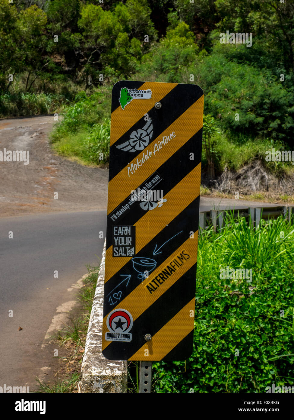Road/Highway Sign in Maui with stickers covering it. Many signs like this in Maui mainly Surfing