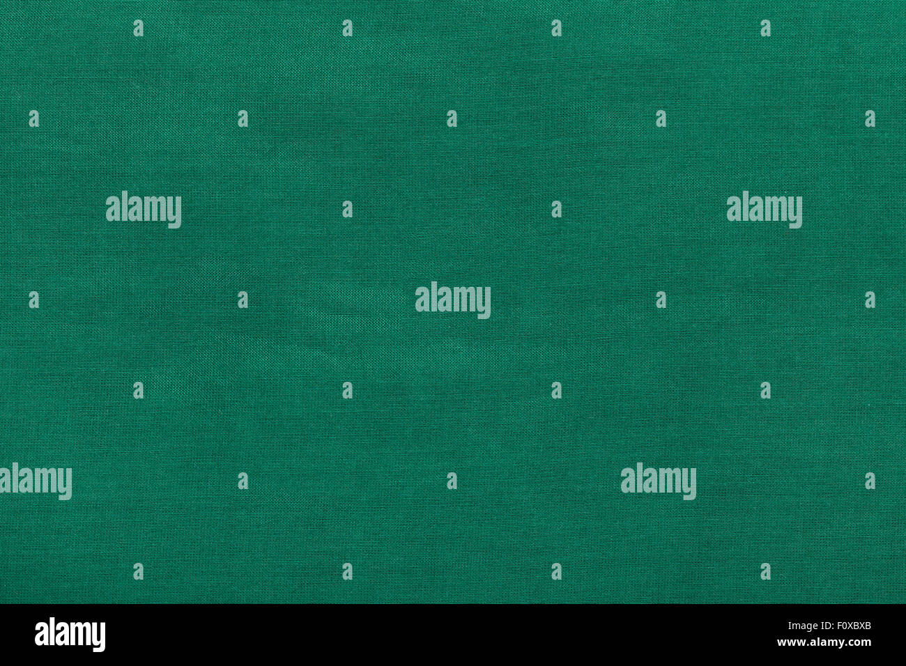 background from dark green batiste fabric close up Stock Photo