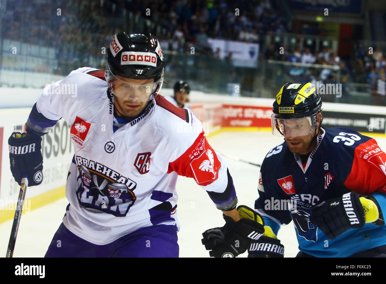 Ingolstadt, Germany. 22nd Aug, 2015. Champions Hockey League. ERC Ingolstadt versus Braehead Glasgow. Stefan MEYER (Glasgow) and Bjoern BARTA (Ingolstadt), Credit:  Action Plus Sports/Alamy Live News Stock Photo