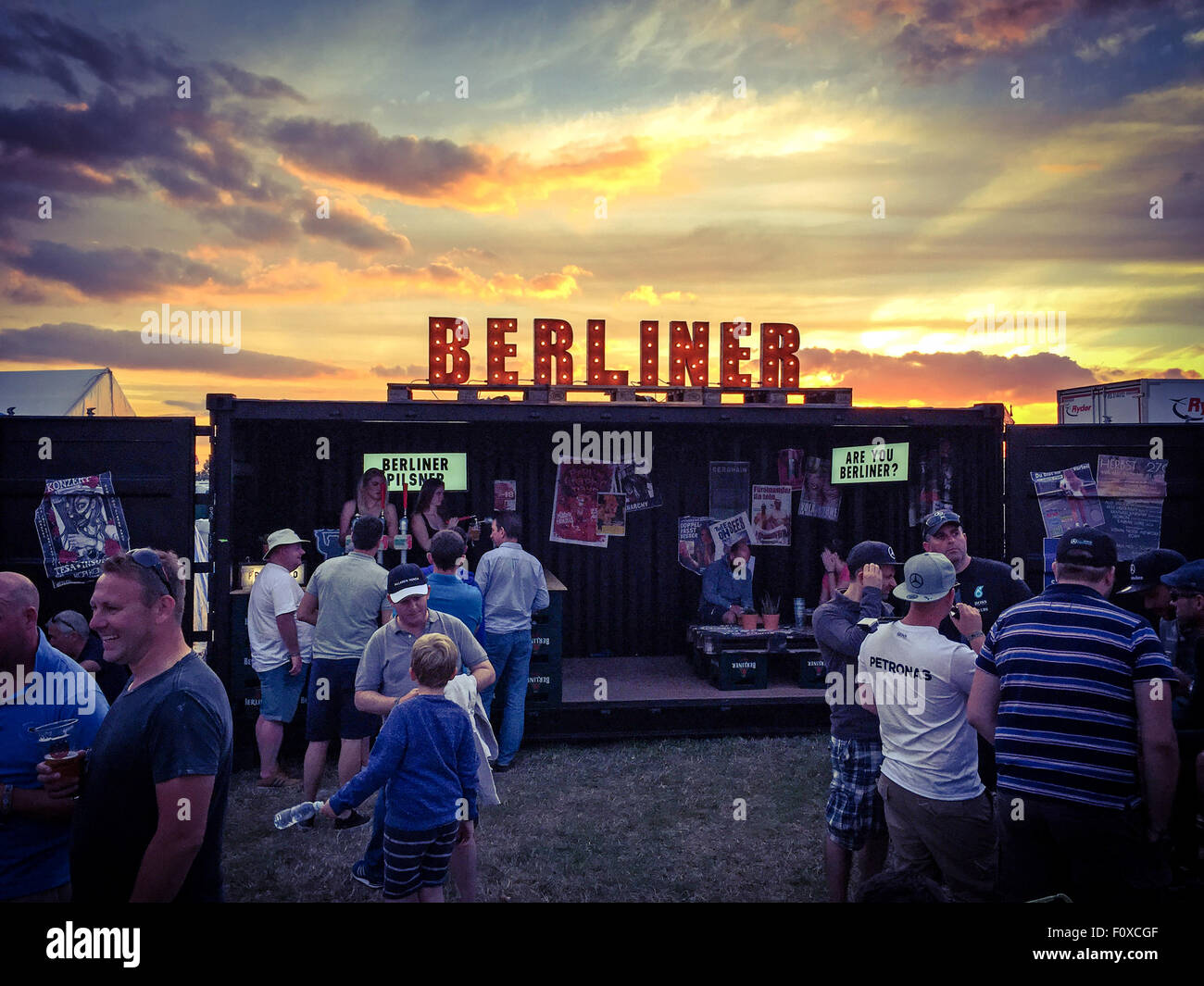 Berliner sign in lights with sky behind, bar serving bier Stock Photo
