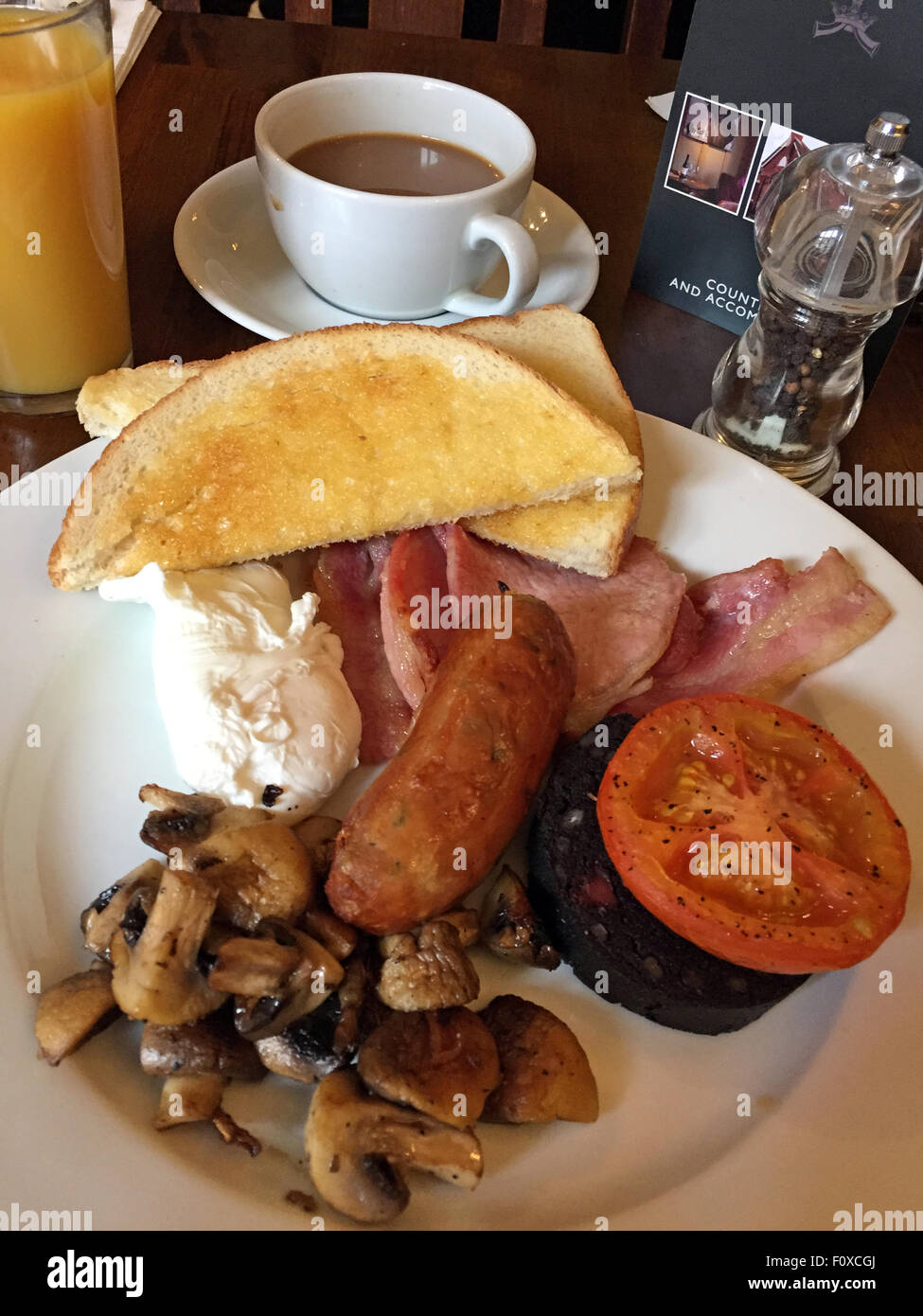 Traditional Full English Breakfast,Egg,Sausage,Bacon,Black Pudding,Toast,Mushroom Stock Photo