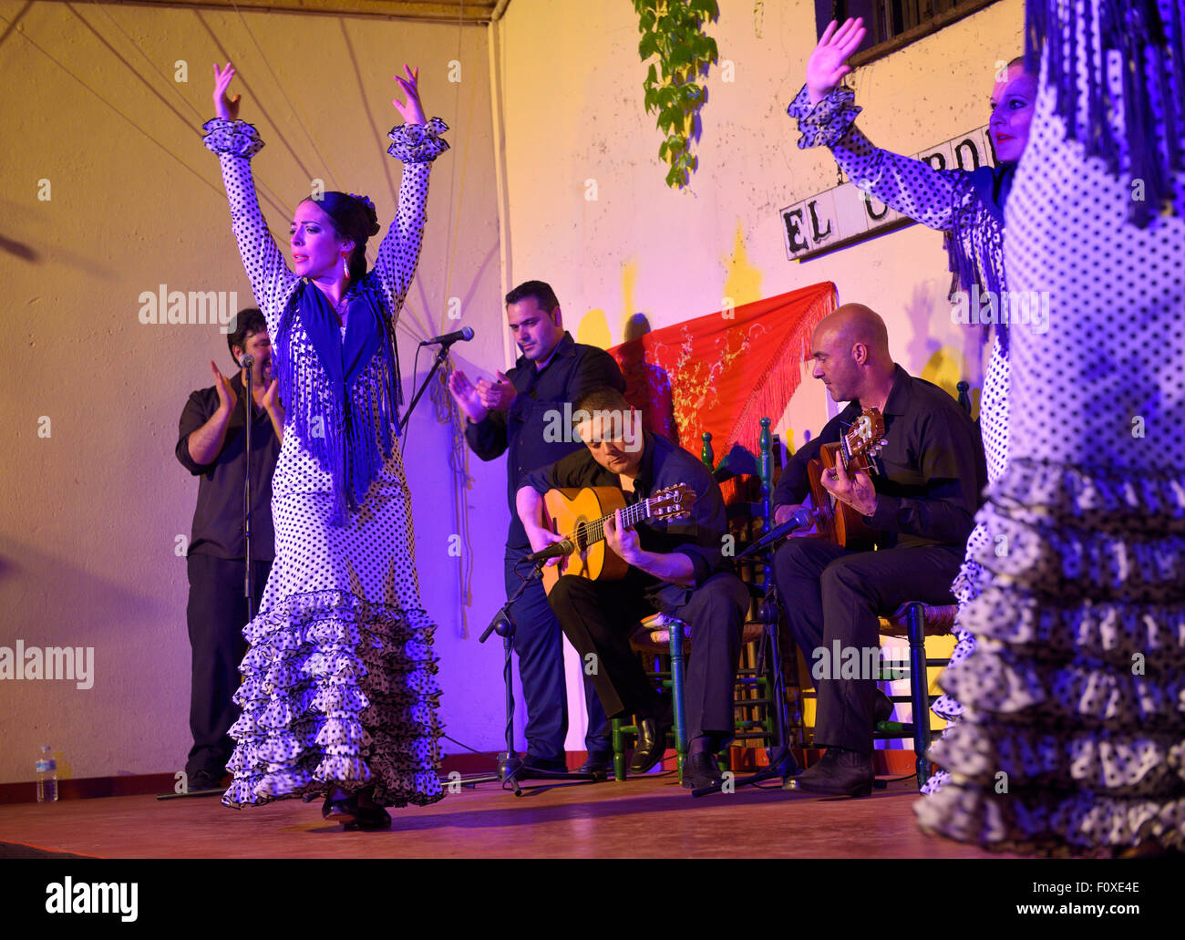 Female Flamenco dancers on stage with musicians at night in an outdoor courtyard in Cordoba Spain Stock Photo