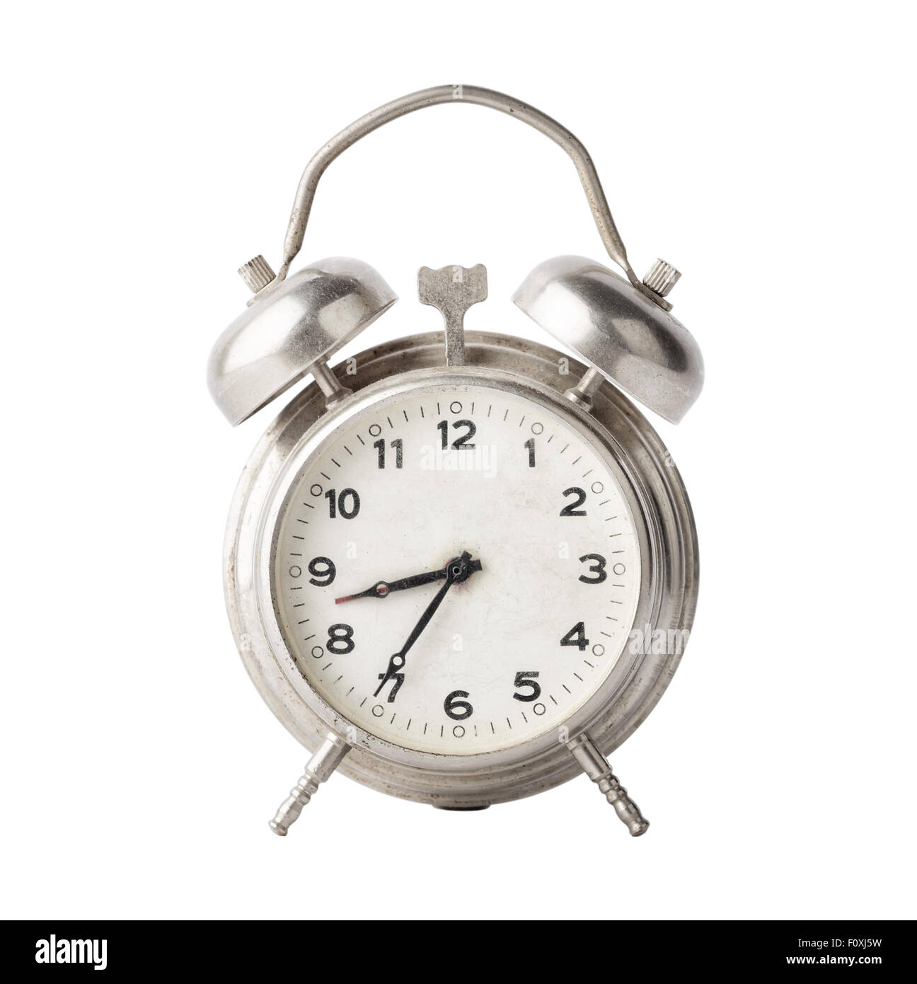 Old metal alarm clock isolated on white background Stock Photo - Alamy