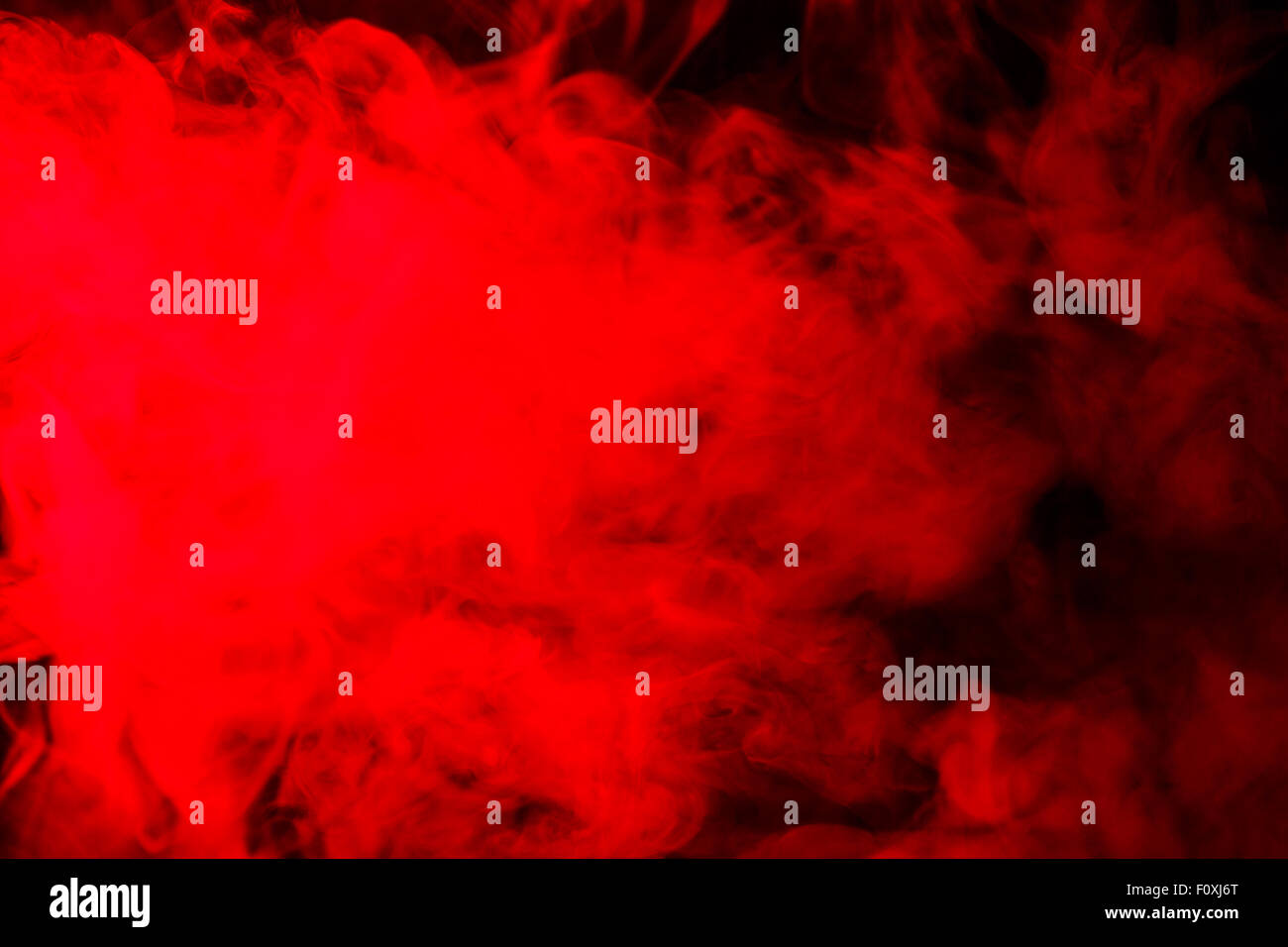 Abstract red-orange hookah smoke on a black background. Photographed