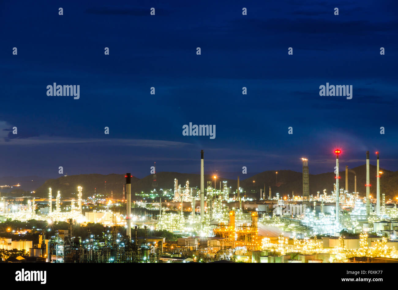 petrochemical industry on sunset with dark blue sky. Stock Photo
