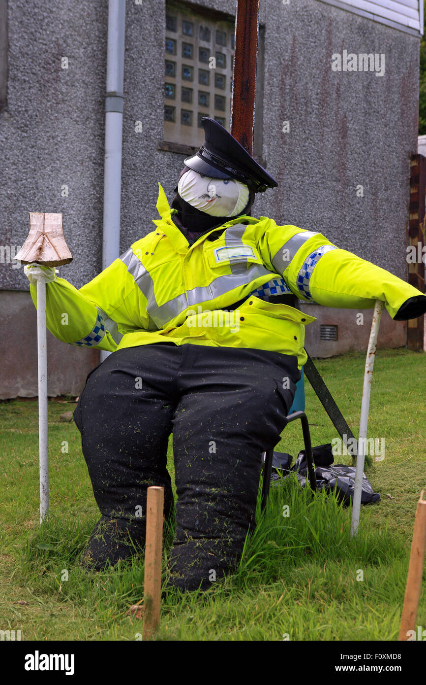 Policeman scarecrow outside Kames Police station near Tighnabruaich in Argyll Scotland, part of the annual Scarecrow trail Stock Photo