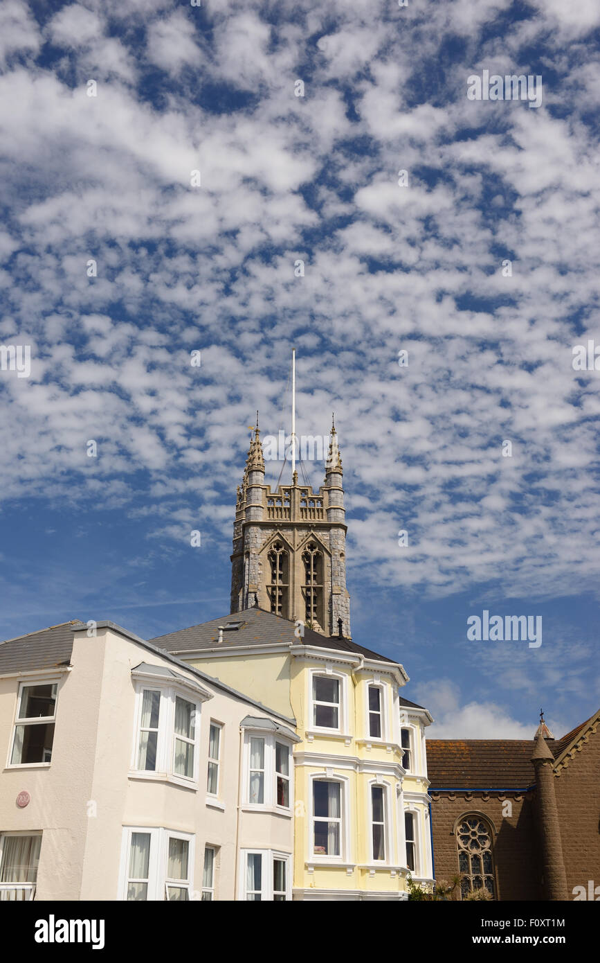 Cloud formation over the church tower of St Michael the Archangel. Stock Photo