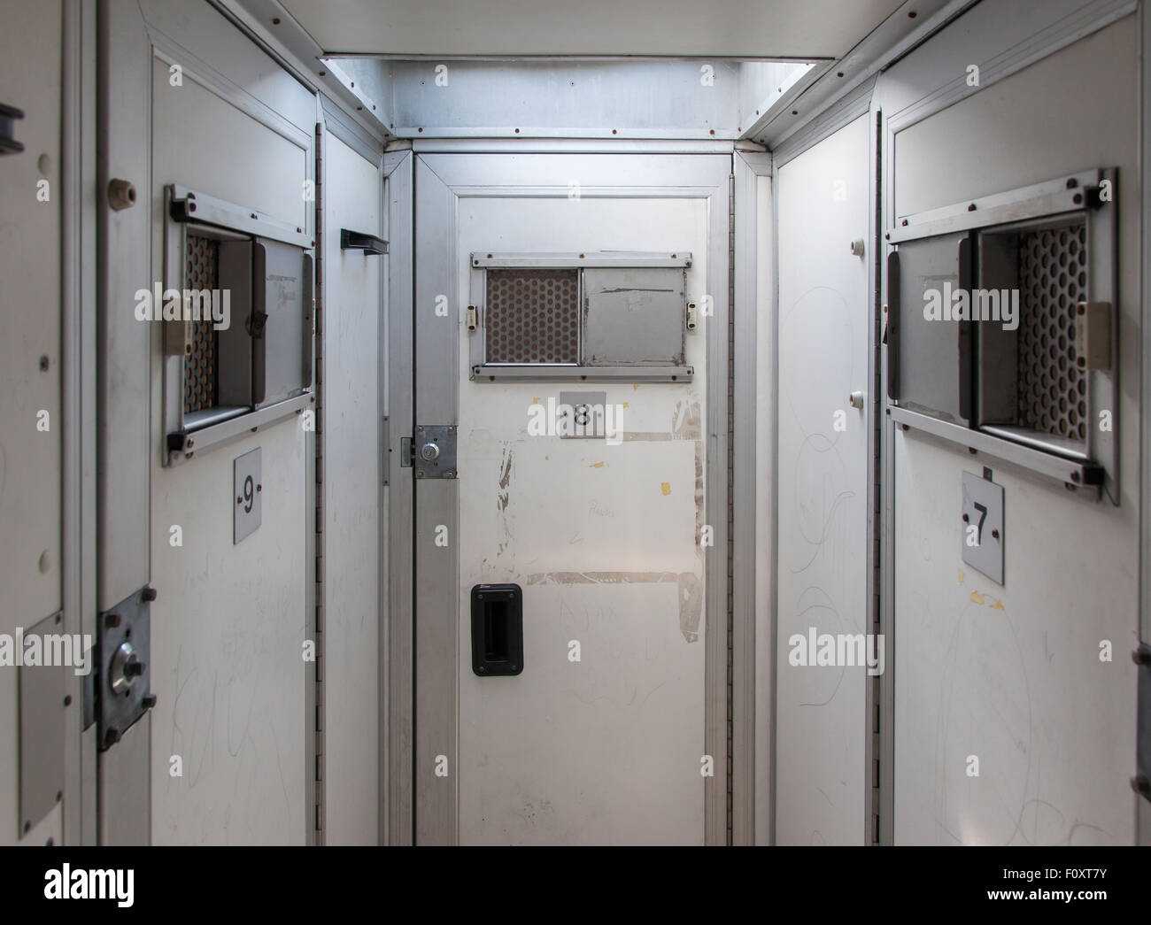 Inside of a large bus used by police to transport prisoners for public safety Stock Photo