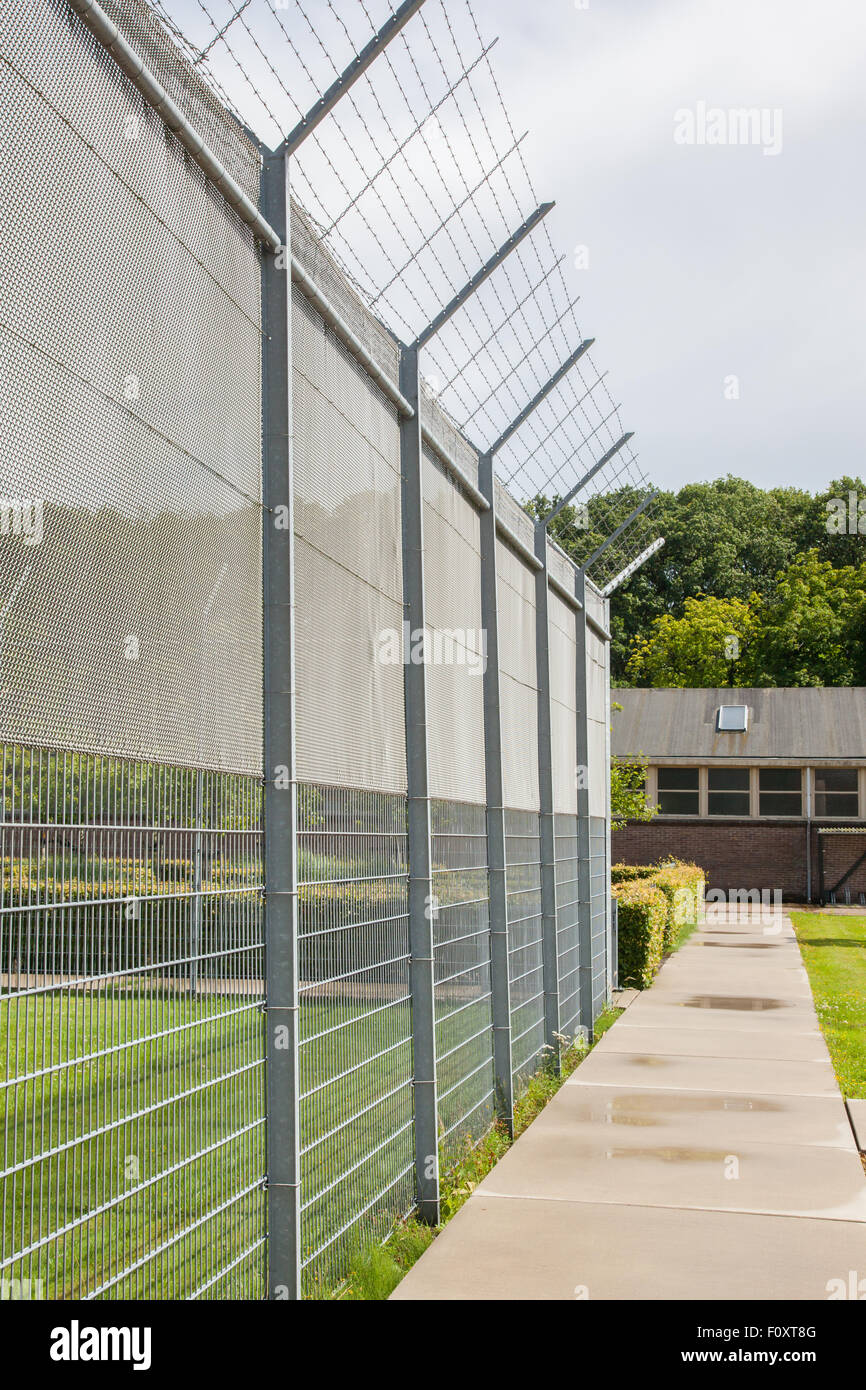 Fence around restricted area, old jail in the Netherlands Stock Photo
