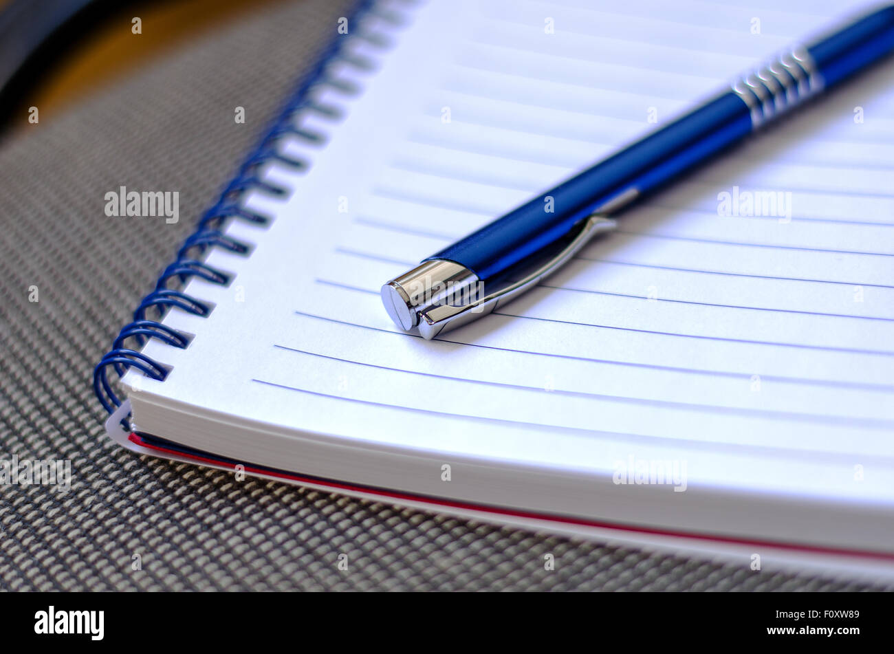 Blue notepad and place for conceptual text Stock Photo - Alamy
