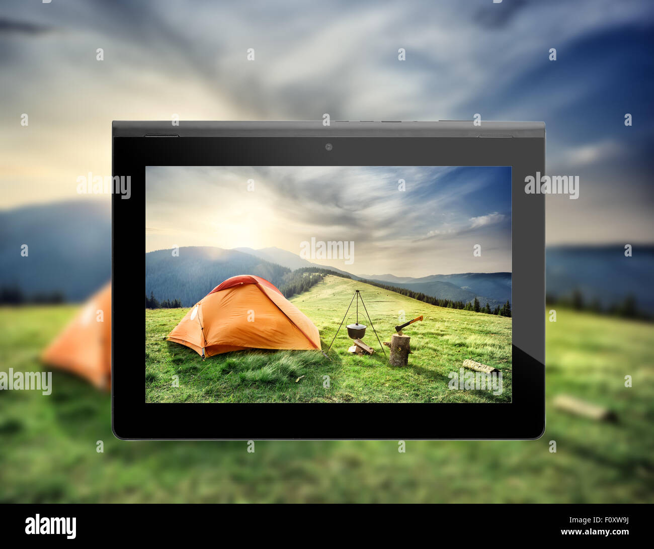 Photos mountain landscape with a tent to shoot at the plate Stock Photo