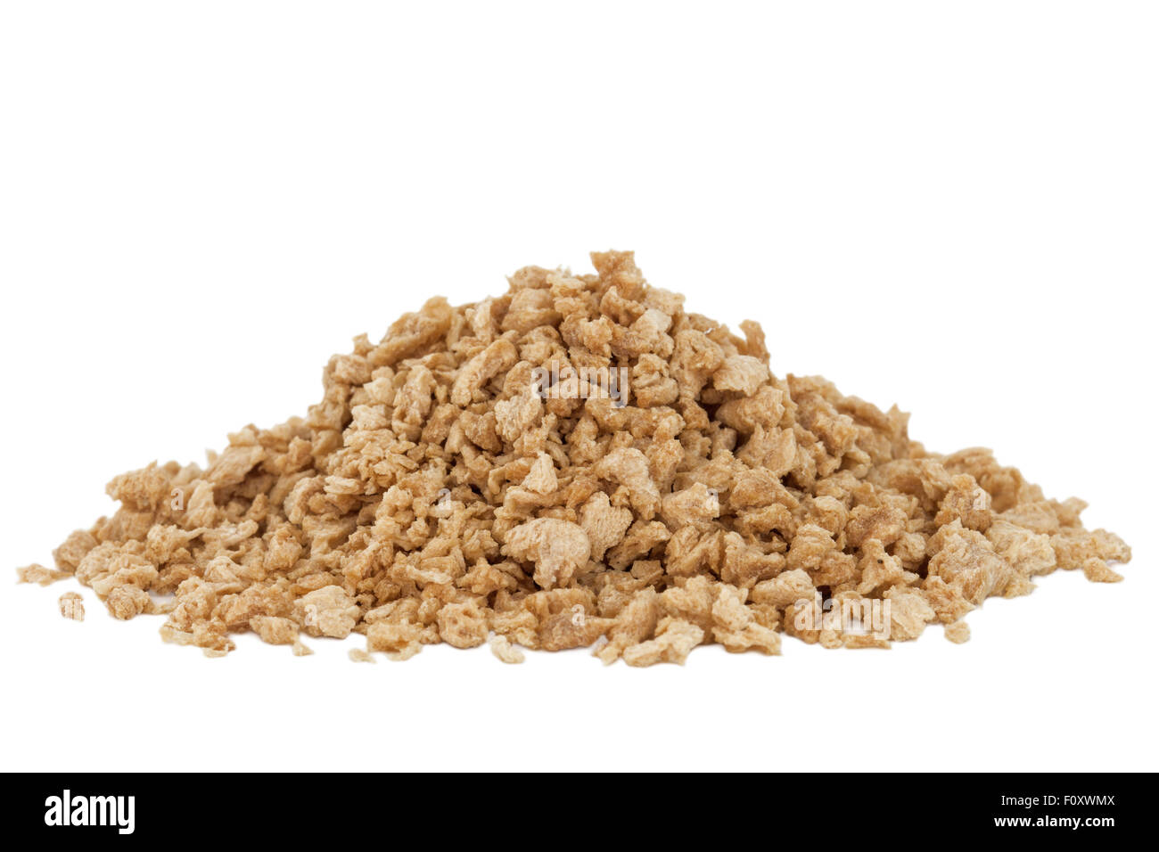 Heap of textured soy protein granules isolated on white background. Stock Photo