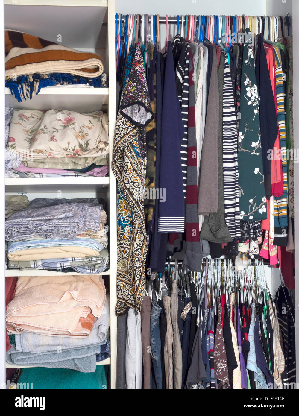 Open closet with shelves and coat hangers Stock Photo Alamy