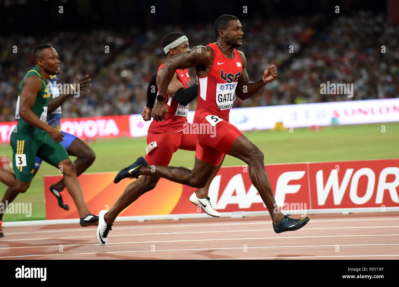 Beijing, China. 23rd Aug, 2015. Justin Gatlin (R) of the U.S competes during the Men's 100 semifinal at the 15th IAAF World Athletics Championships 2015 in Beijing, capital of China, on Aug. 23, 2015. Gatlin advanced into the final with 9.77 seconds. Credit:  Xinhua/Alamy Live News Stock Photo