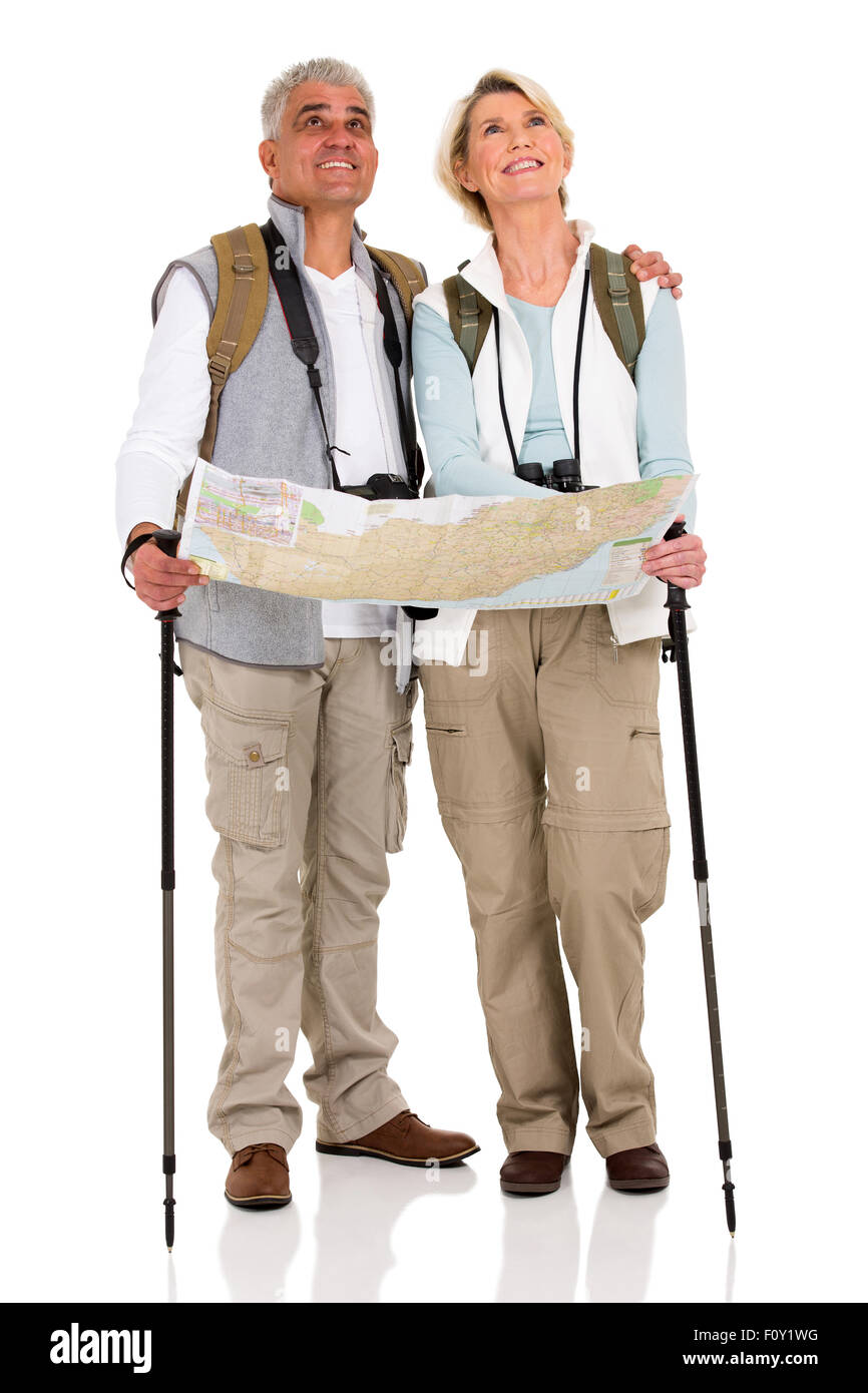 beautiful middle aged couple with backpacks and map on white background Stock Photo