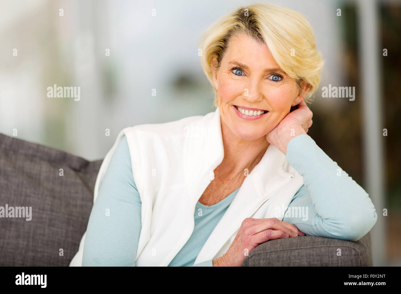 portrait of beautiful senior woman sitting indoors Stock Photo - Alamy