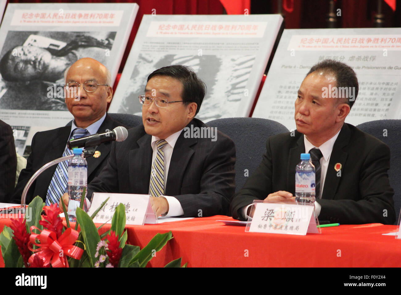 Lima, Peru. 22nd Aug, 2015. Chinese Ambassador to Peru Jia Guide (C) delivers a speech during the exposition 'La Historia No Se Puede Olvidar' (History Can Not Be Forgotten) at the facilities of the Chinese Charity Central Society in Lima city, Peru, on Aug. 22, 2015. Chinese community in Peru is celebrating the 70th anniversary of the victory of the World Anti-Fascist War with an exposition called 'La Historia No Se Puede Olvidar' (History Can Not Be Forgotten). (Xinhua/Luis Camacho) (rhj) © /Xinhua/Alamy Live News Stock Photo