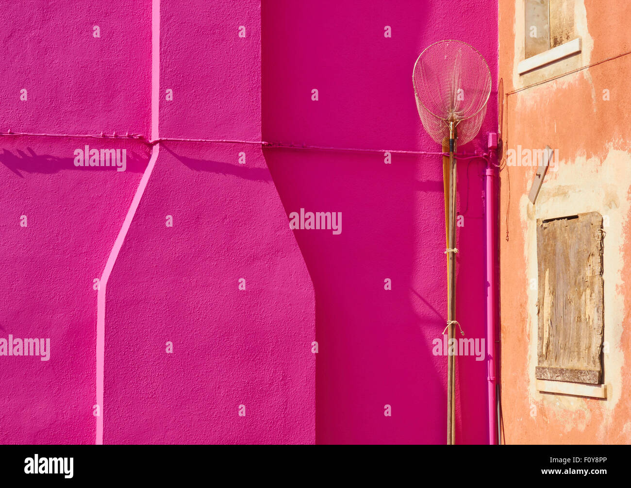 Fishing net against bright pink wall next to boarded up house Burano  Venetian Lagoon Veneto Italy Europe Stock Photo - Alamy