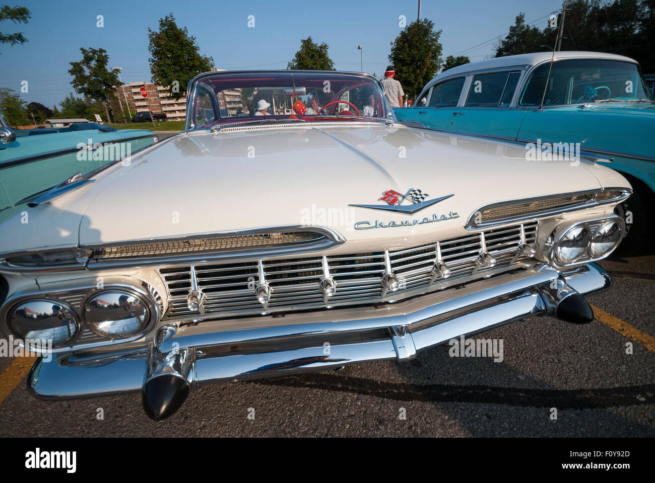 A Restored Vintage White 1959 Chevrolet Impala On Display In A Shopping Center Parking Lot Stock Photo Alamy
